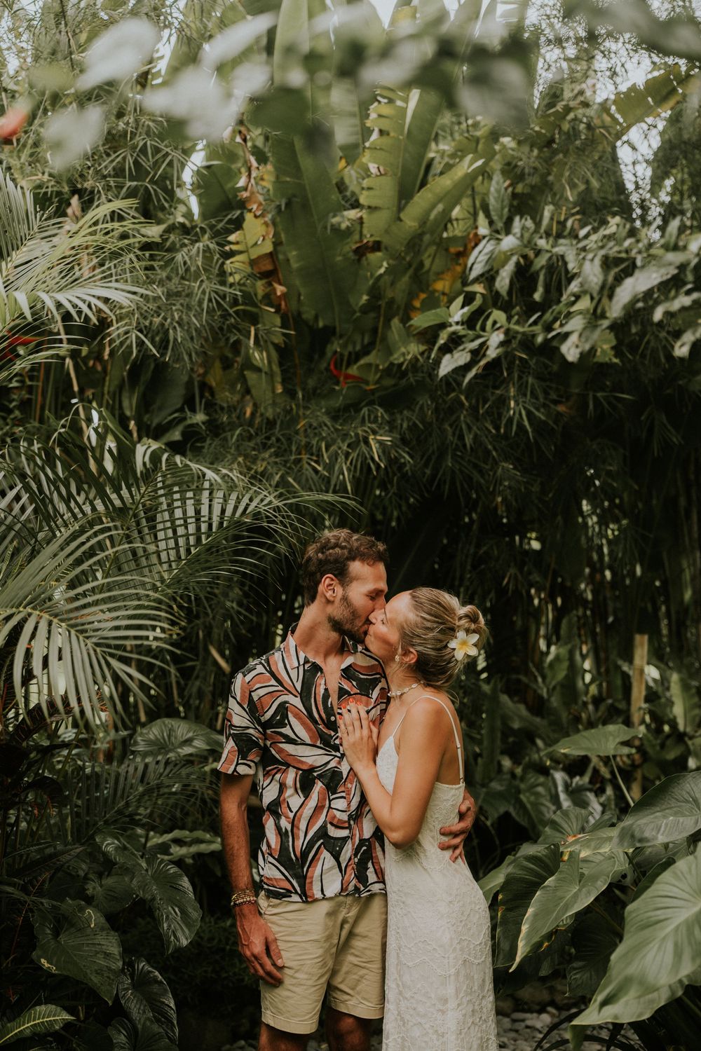 Couple portrait at Bamboo House in Karangasem Bali with tropical green garden