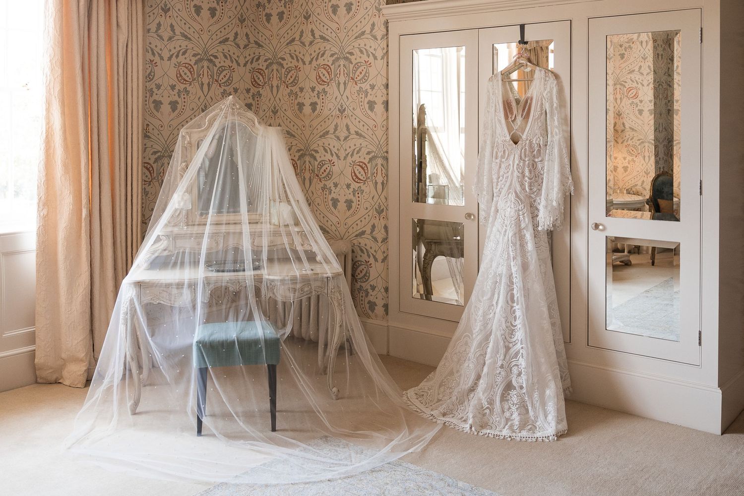 Wedding dress and accessories ready for the bride in the Hodsock Priory Honeymoon Suite.