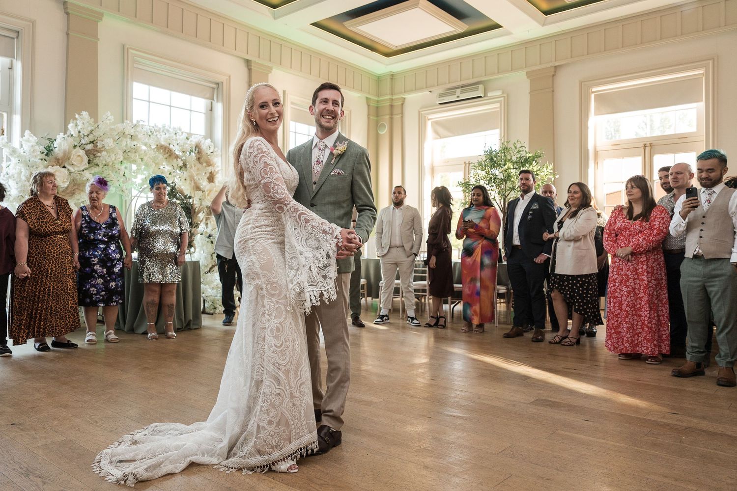 Couple’s first dance in the Hodsock Priory Pavilion surrounded by guests