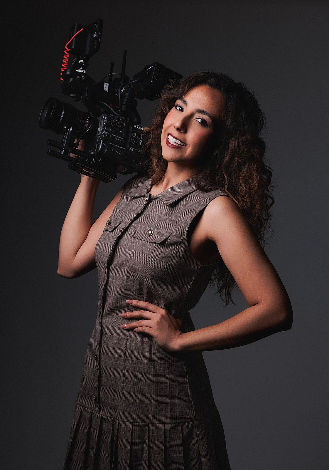 A black and white photo series shows a person posing with a vintage camera in different playful positions.
