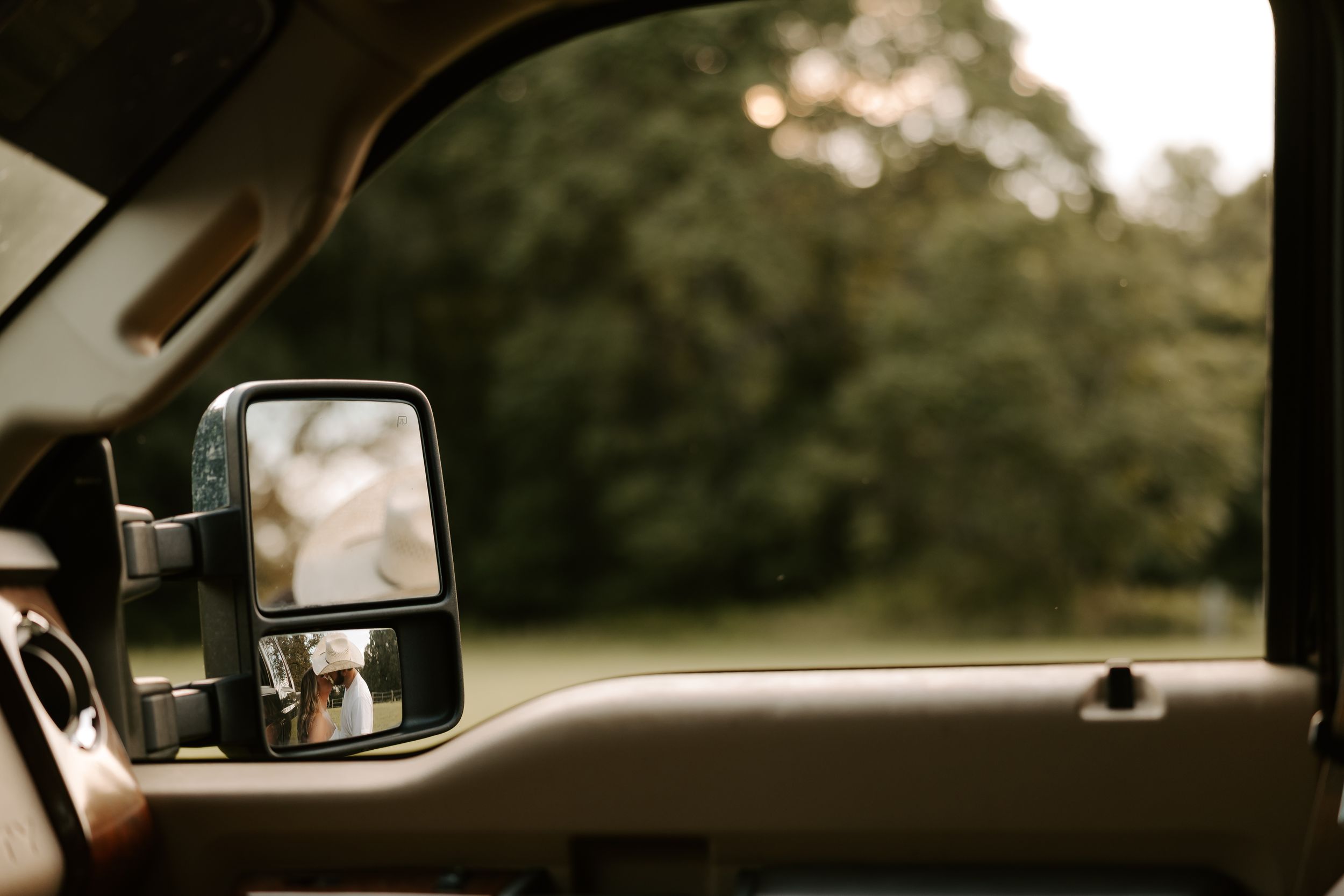 Series of artistic shots taken through car windows and mirrors at sunset.