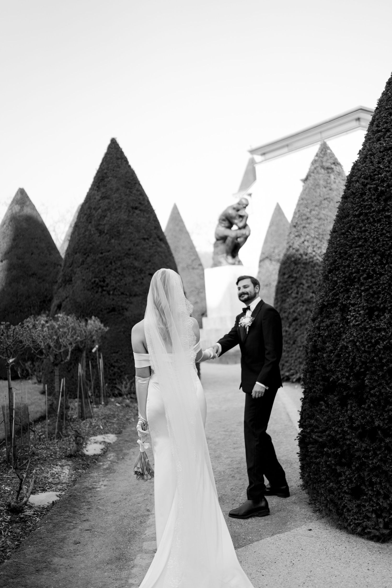 Bride in editorial wedding dress at Musée Rodin Paris, cinematic wedding photography. Paris film wedding photography