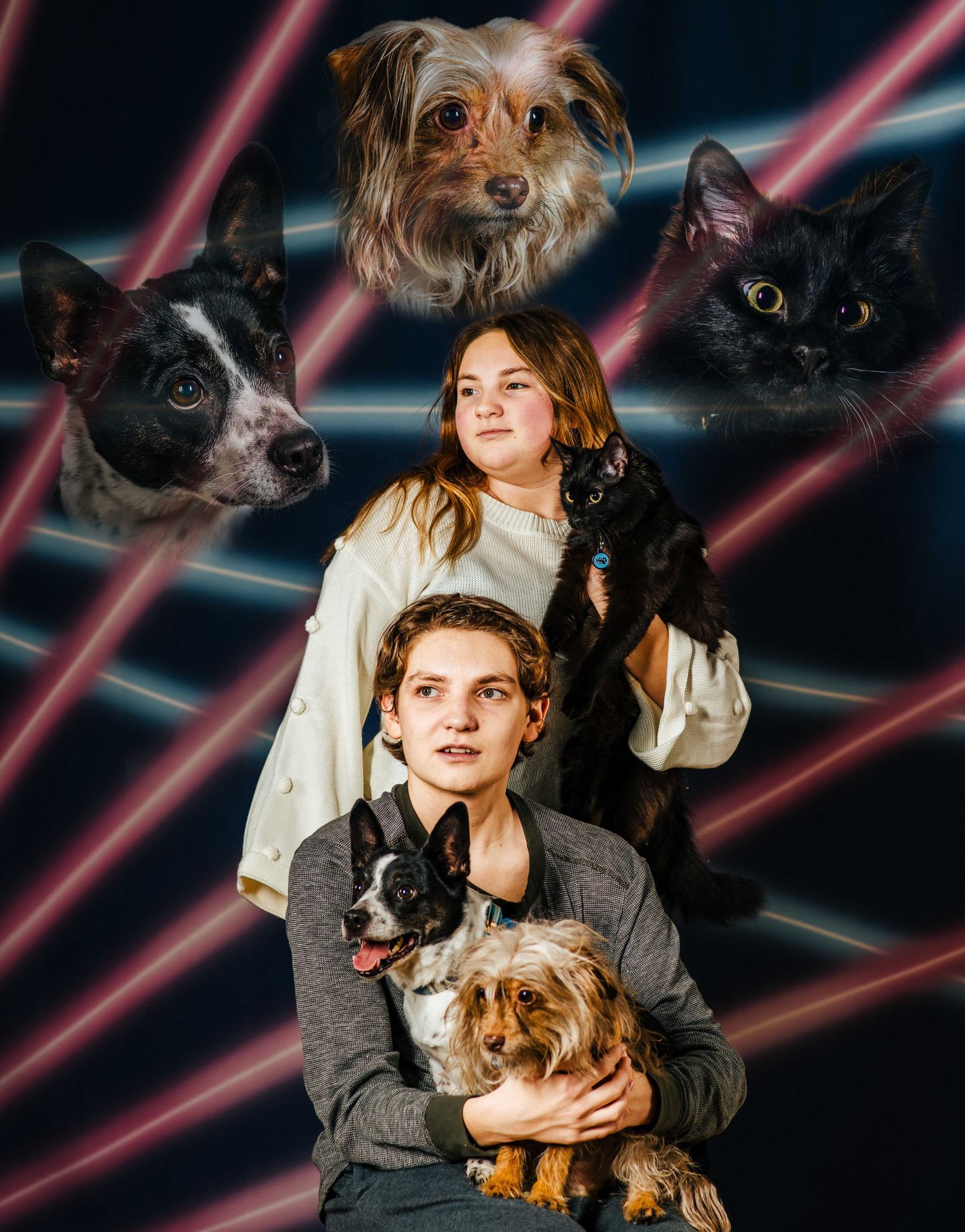 Two kids pose with dogs and a cat in a retro laser background portrait photo.