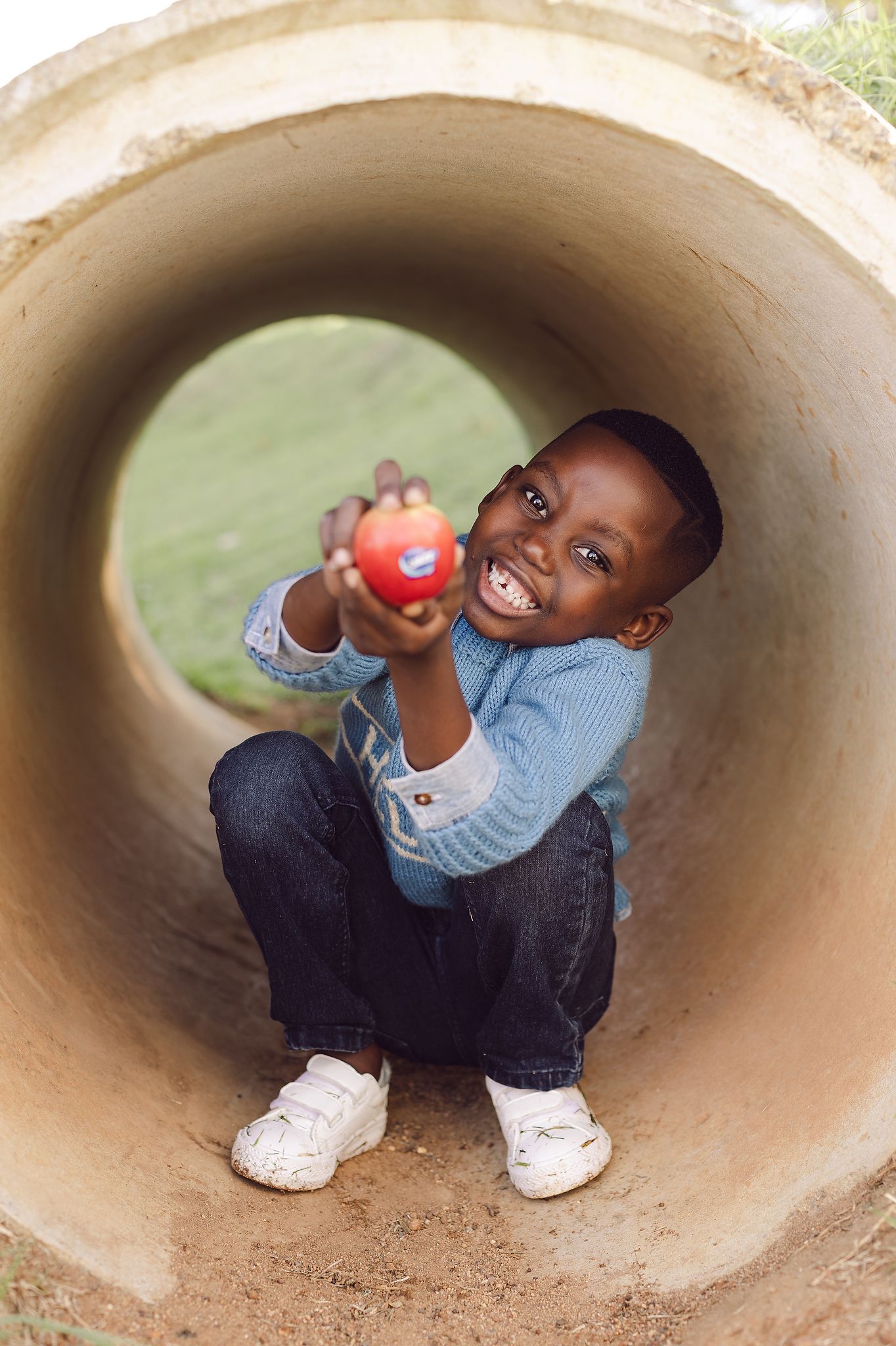 Young boy posing with Jazz Apple