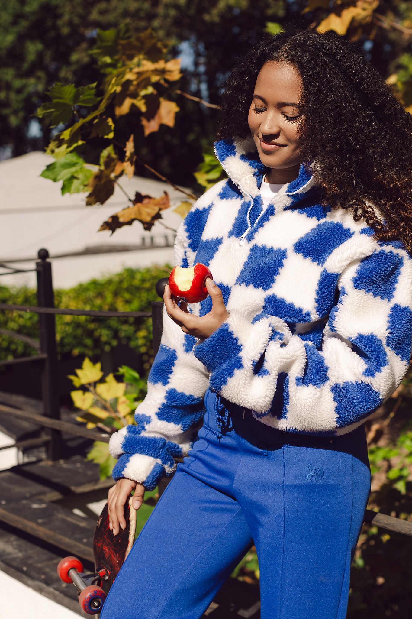 Young woman admiring the delicious Jazz Apple