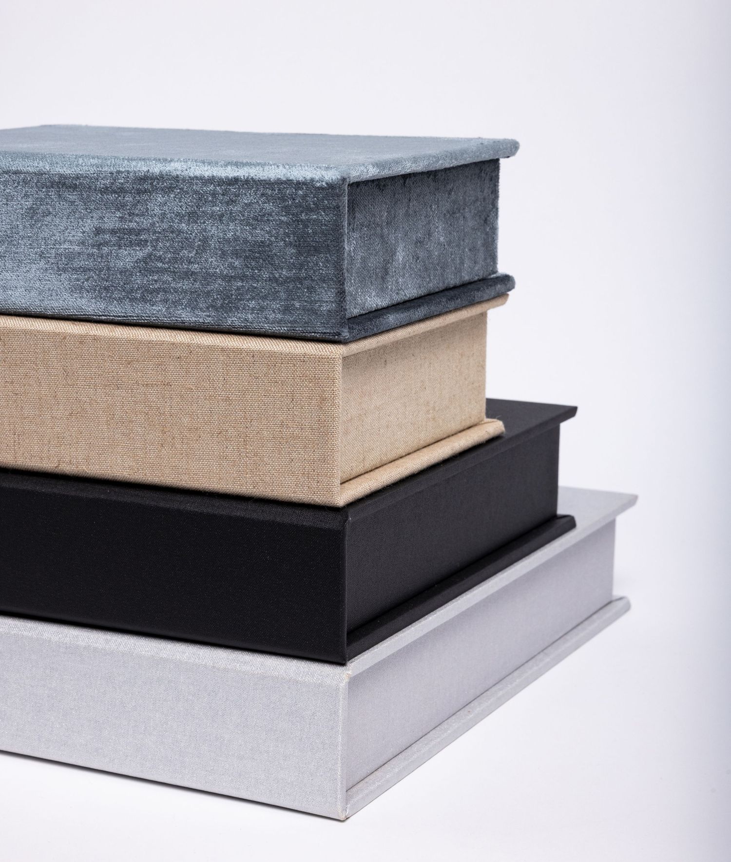 Stack of four portrait boxes holding pet portraits inside by fetching fido fotography.