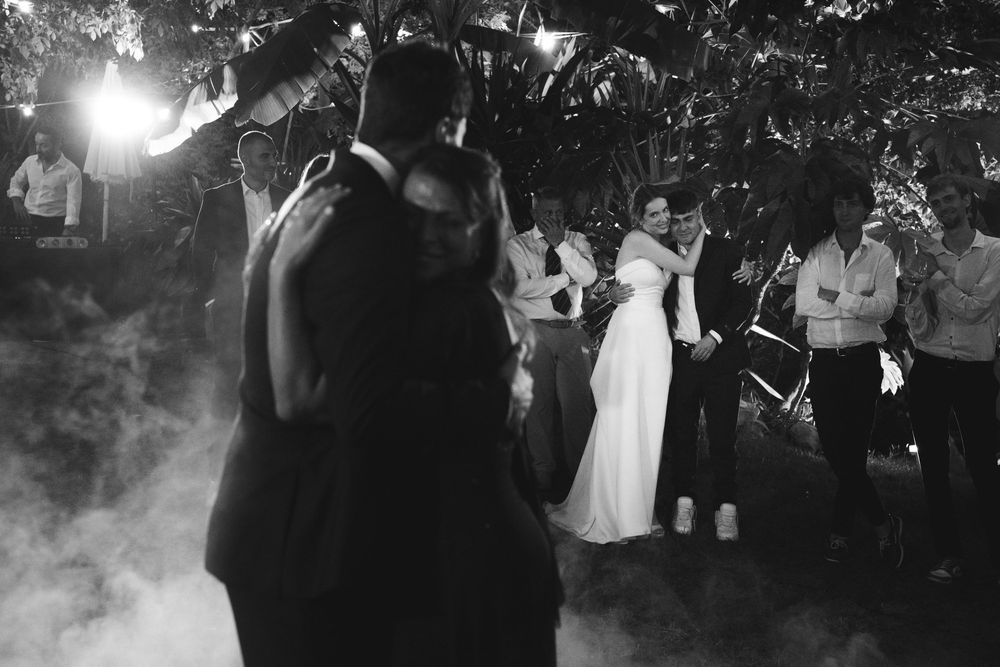 The groom's brother gets emotional watching his brother dance with his mother