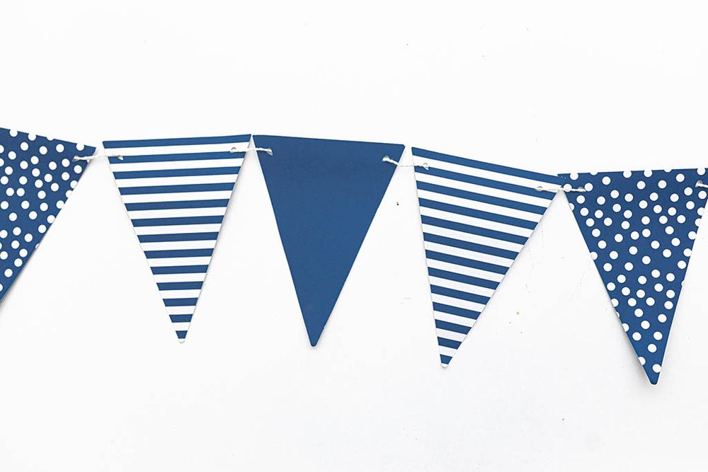 Navy blue striped and polka dot triangle pennant flag party bunting.