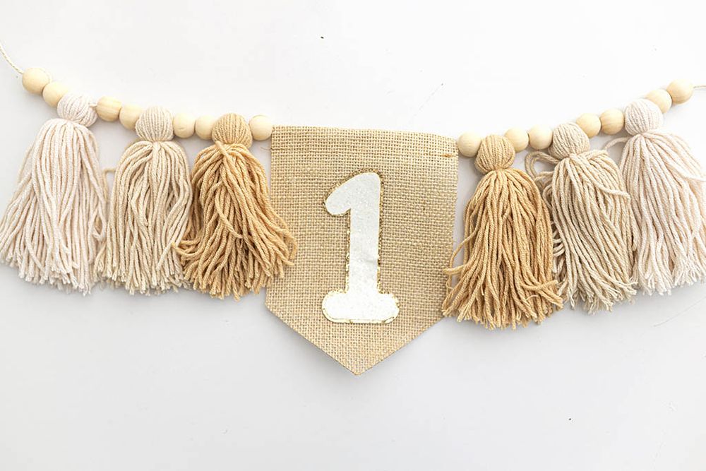 Burlap first birthday banner with; timeless neutral first birthday photoshoot in Southern California.