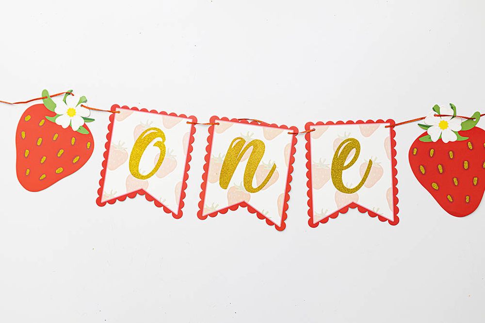 Sweet Little One strawberry themed first birthday banner spelling ONE for cake smash photography in Temecula area.