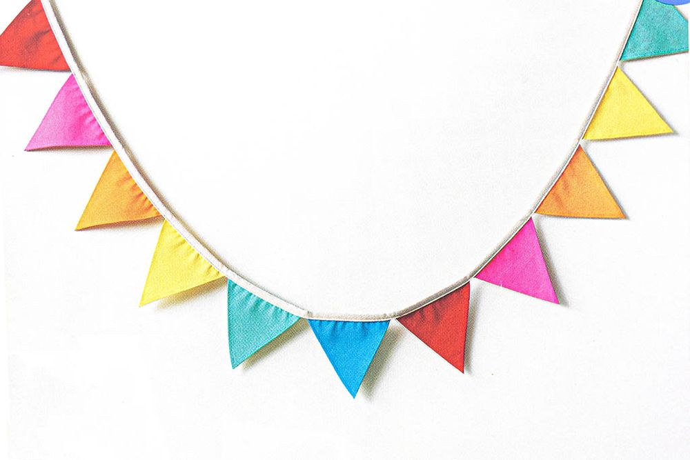 Colorful rainbow triangle pennant bunting banner in multicolor fabric for party decor.