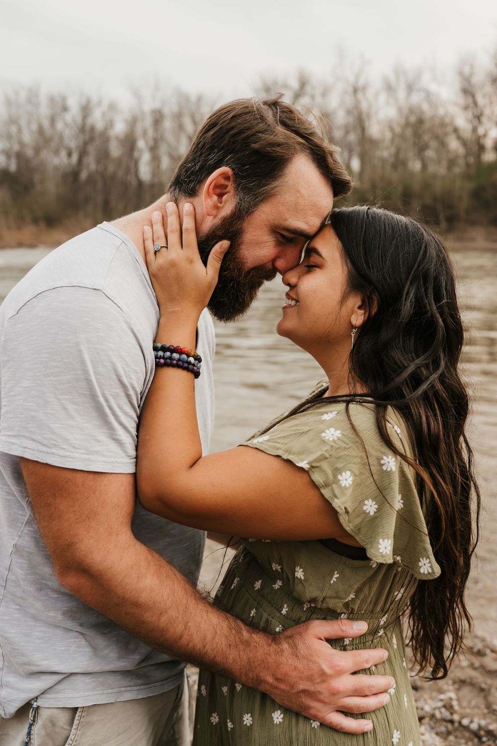 couple embraces during engagement photos in cincinnati