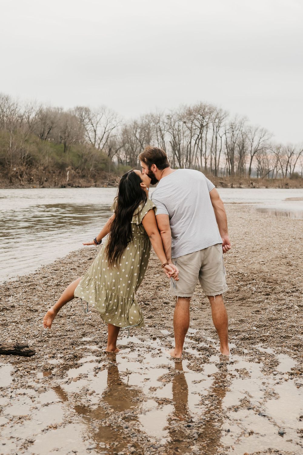 couple embraces during engagement photos in cincinnati