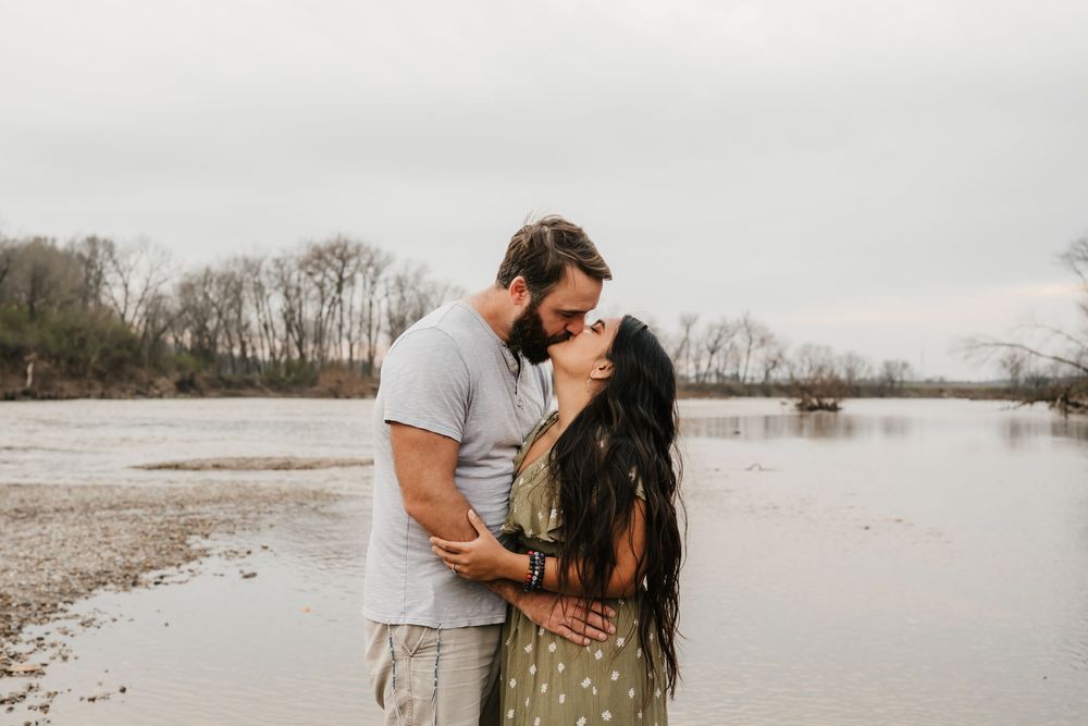 couple embraces during engagement photos in cincinnati