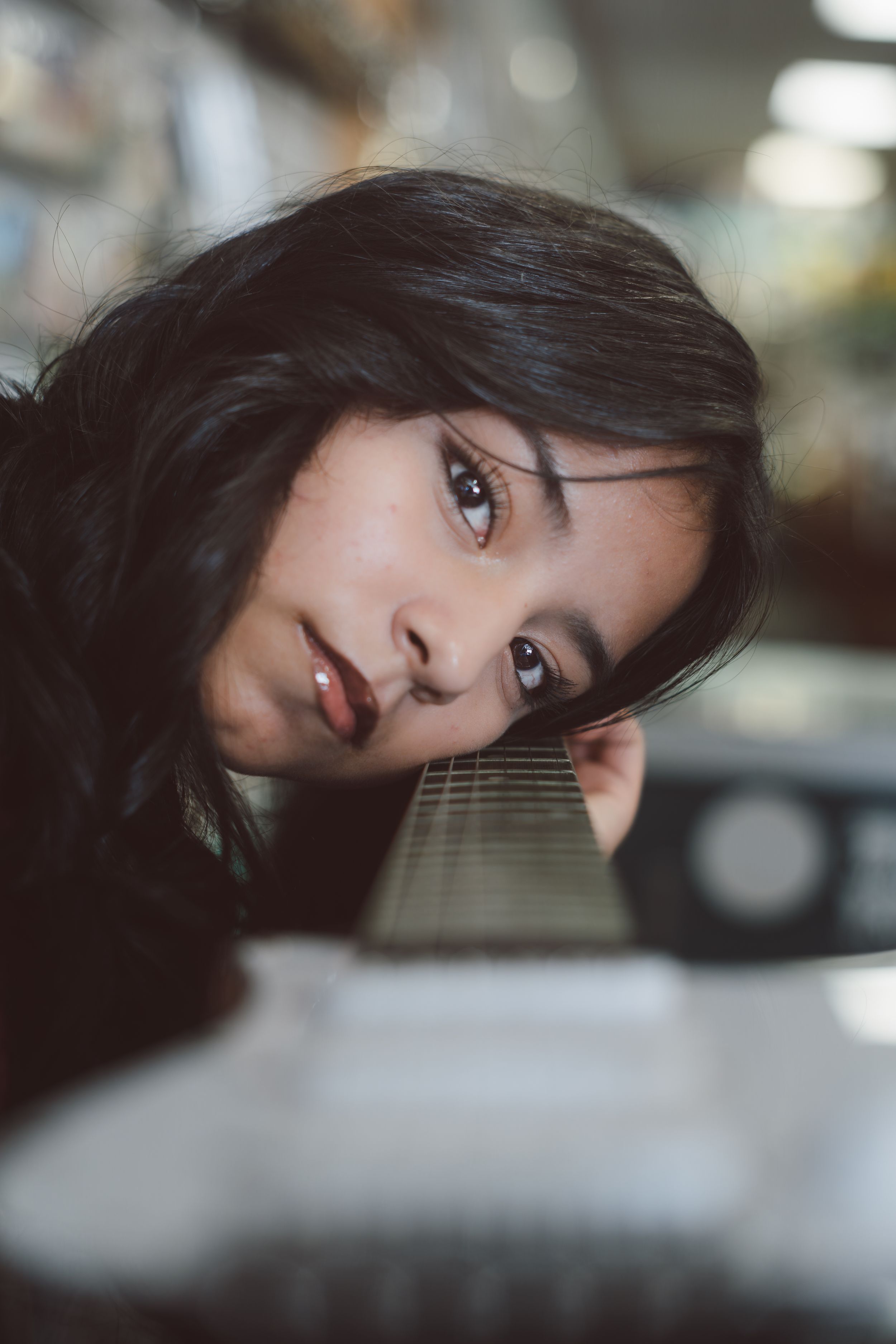 A series of artistic portrait photographs with soft bokeh lighting effects and shallow depth of field.