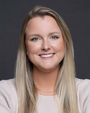 Consultant headshot photographed in Charleston SC with confident expression