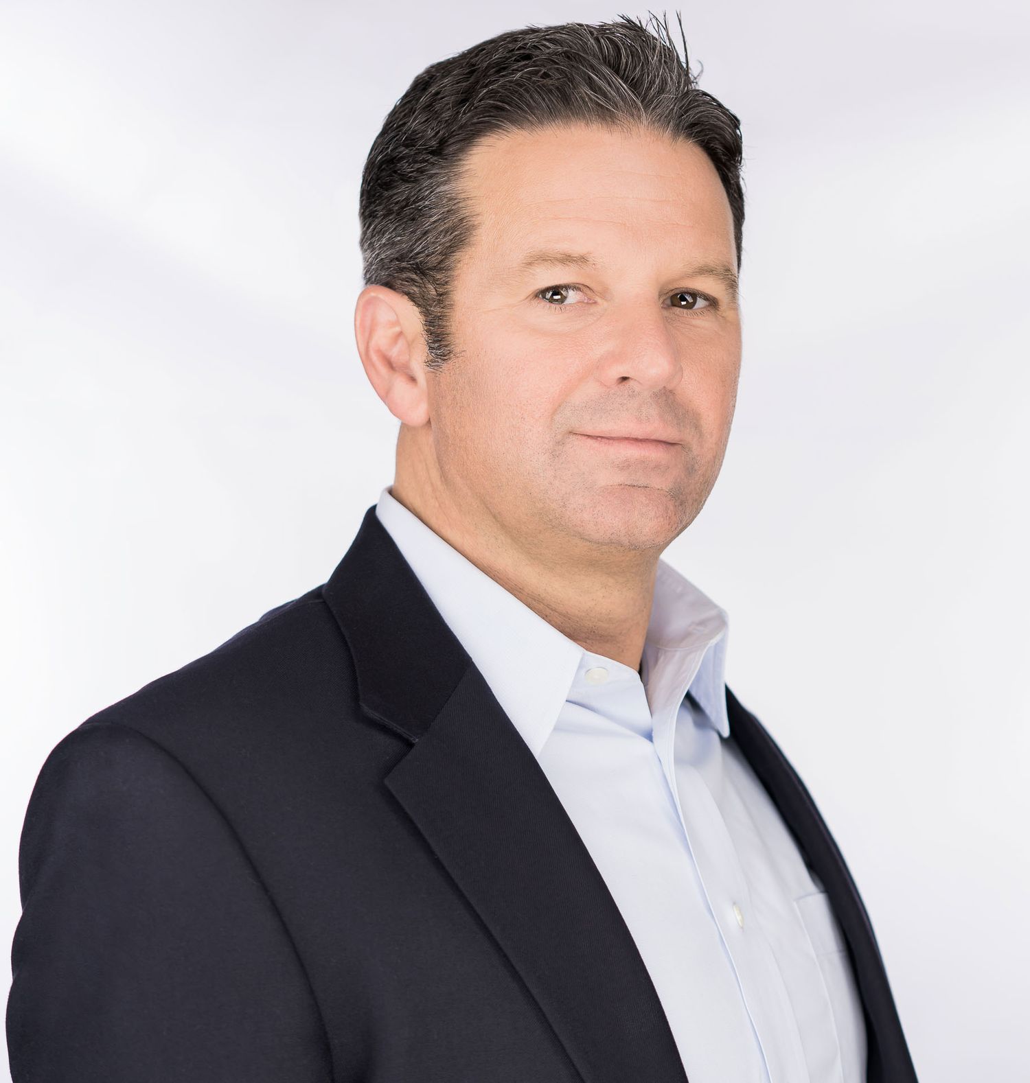 White background corporate headshot of Charleston SC business executive