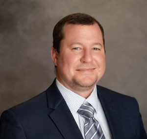 Professional headshot of Summerville SC executive with natural lighting