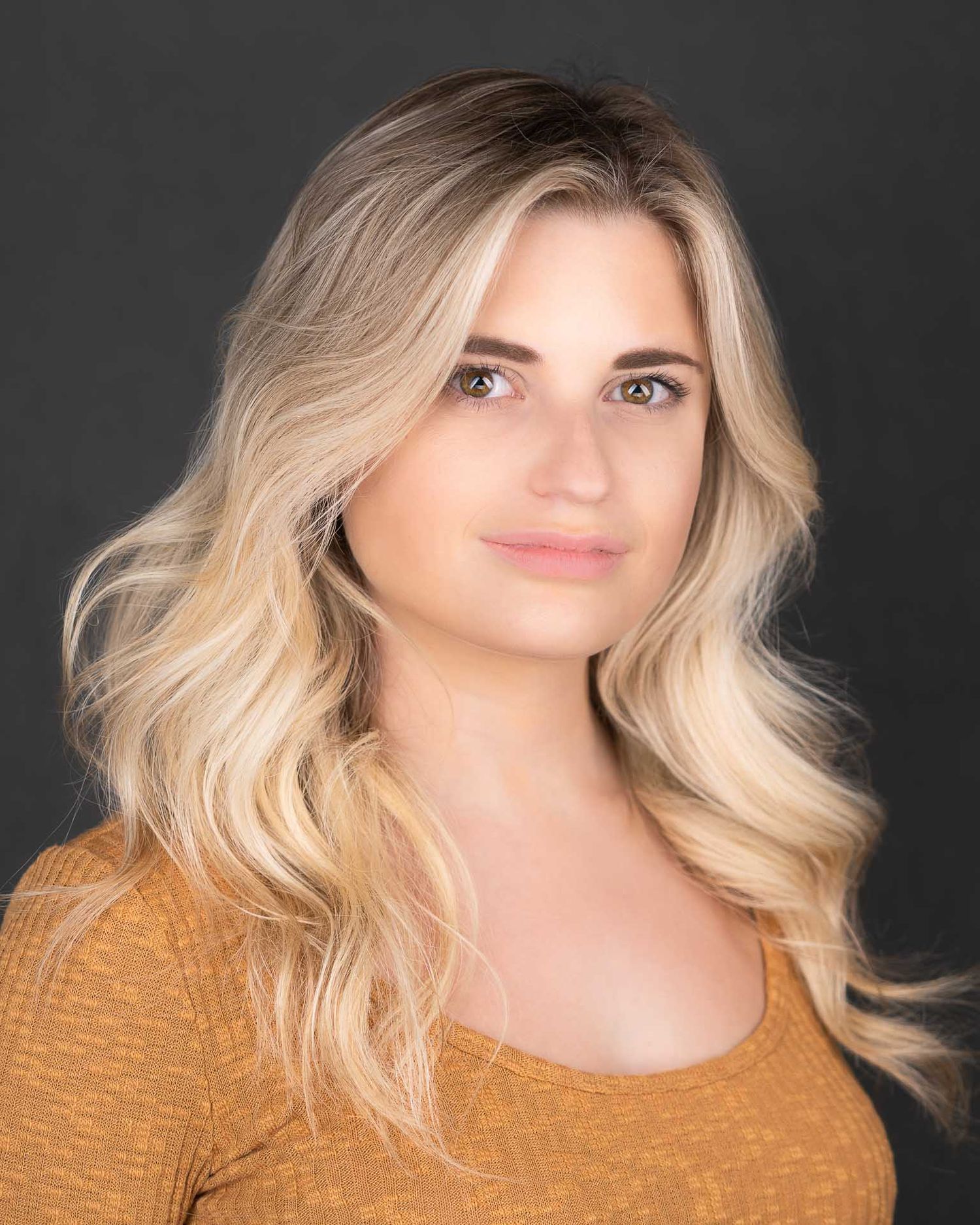 Dramatic dark background executive headshot photographed in Charleston SC