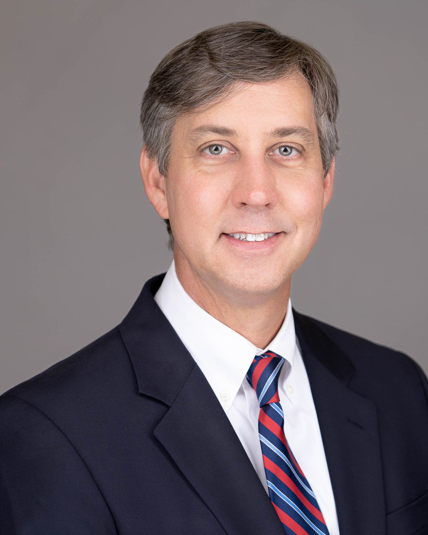 Charleston SC lawyer headshot with dark background and professional lighting