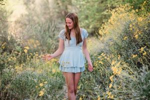 Gilbert Arizona photographer Melissa Maxwell of Jubilee Family Photography. Senior portraits in desert yellow flowers.