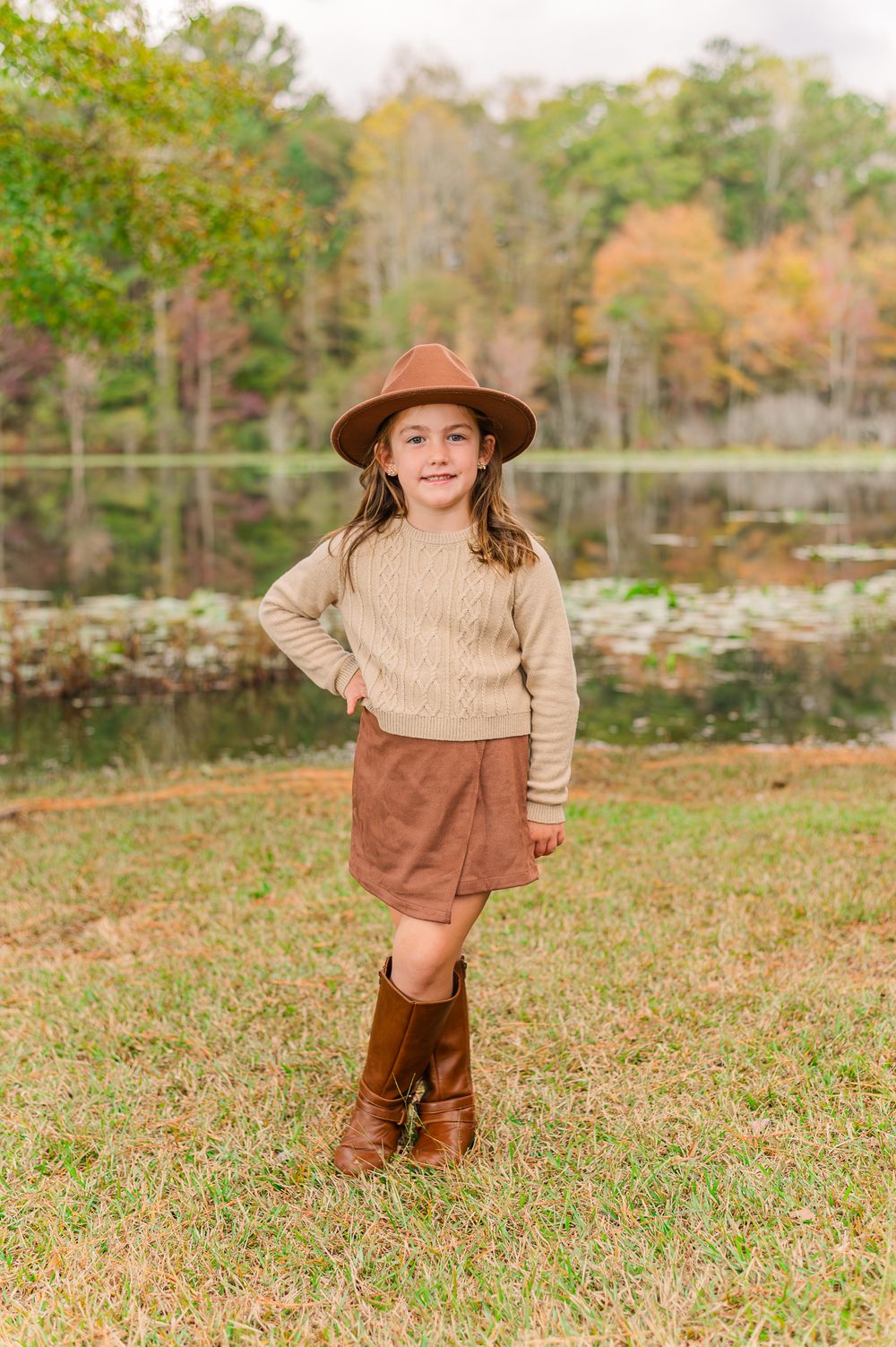 Girl posing in Fall in front of the lake, Senoia, GA