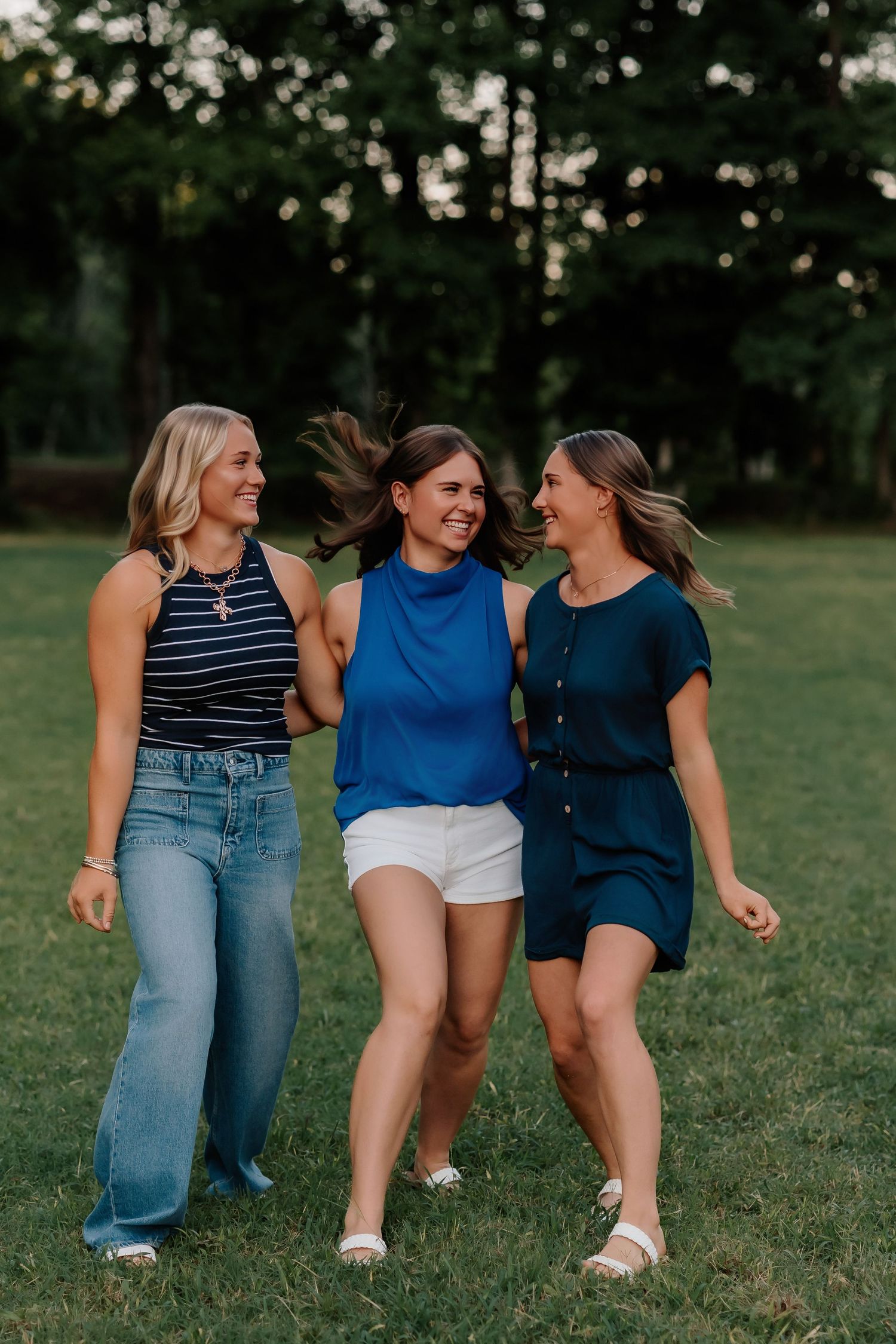 Lonoke Family Photos in Lonoke County, Arkansas- sisters skipping through a field