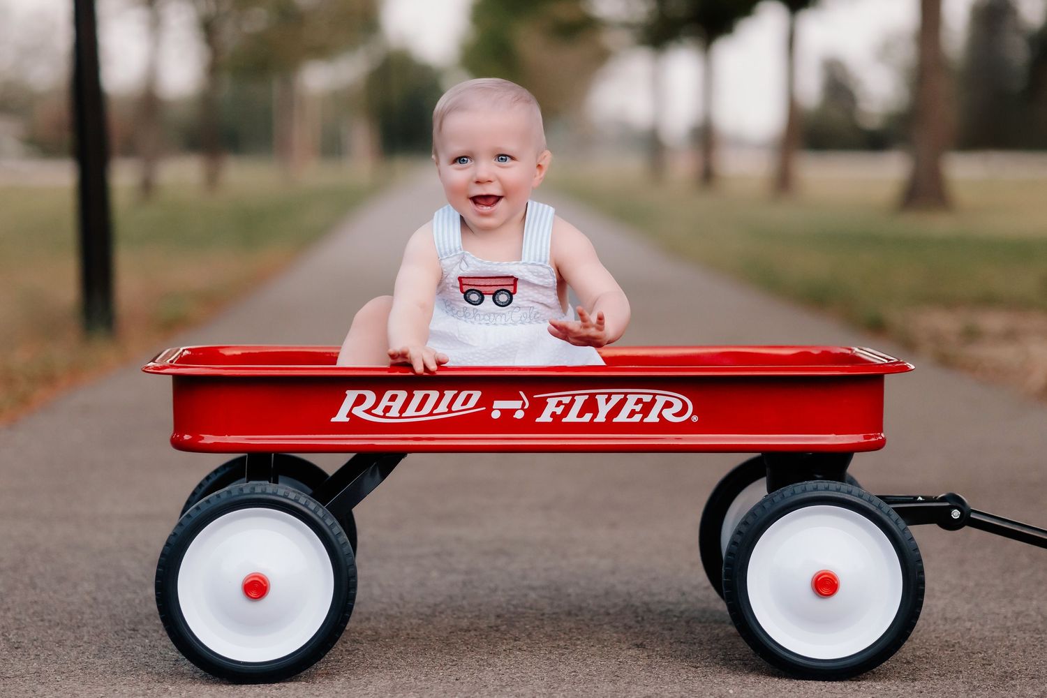 Lonoke Family pictures in Lonoke, Arkansas- 1 year old sitting in radio flyer wagon