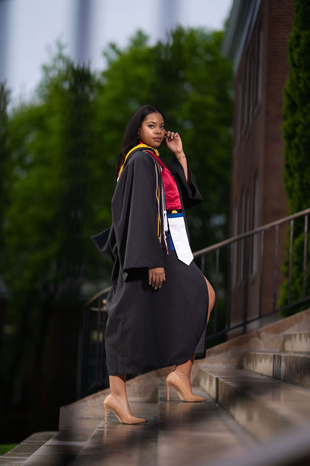 Graduation portrait on steps — editorial shoot by Timoy B Photography.