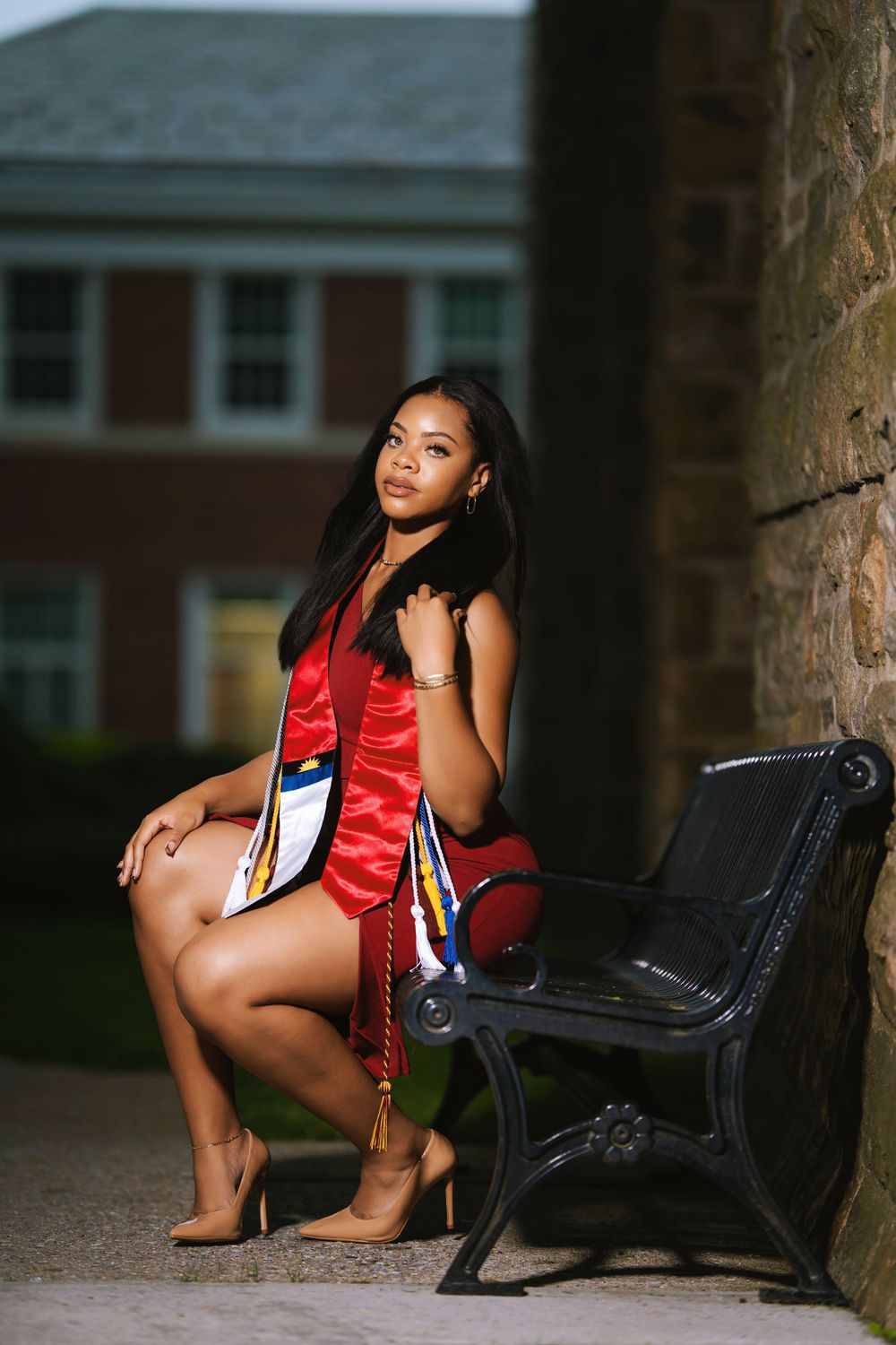 Graduate portrait sitting outside — lifestyle shoot by Timoy B Photography.
