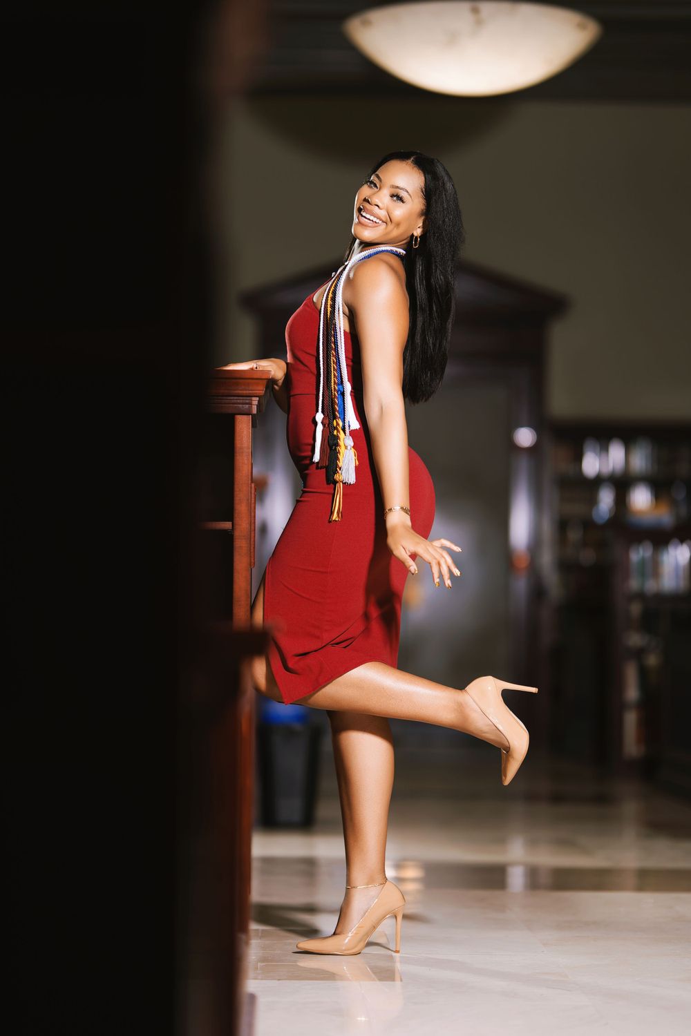 Indoor graduation portrait — creative lifestyle shoot by Timoy B Photography.