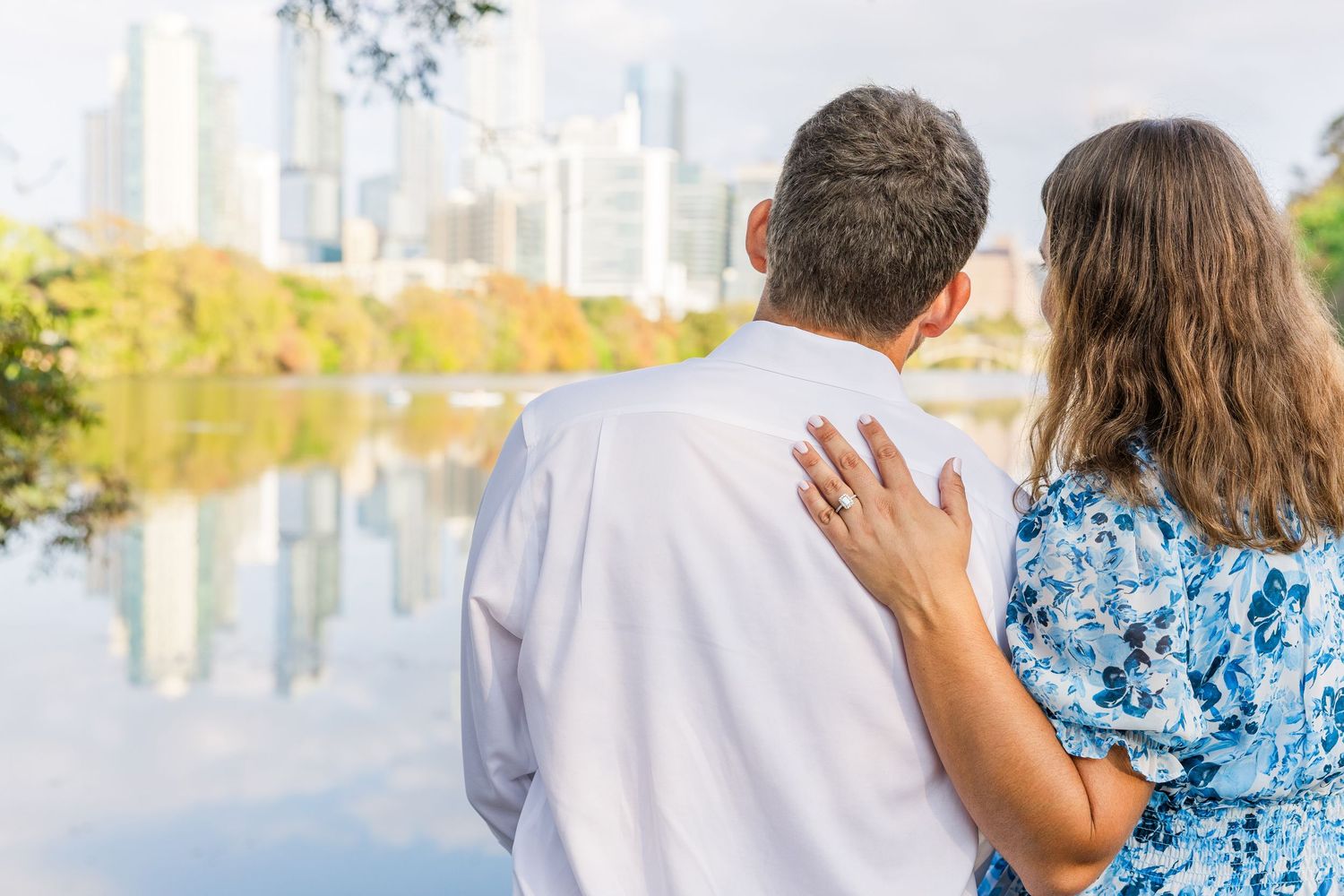 black and white couple kissing on bridge