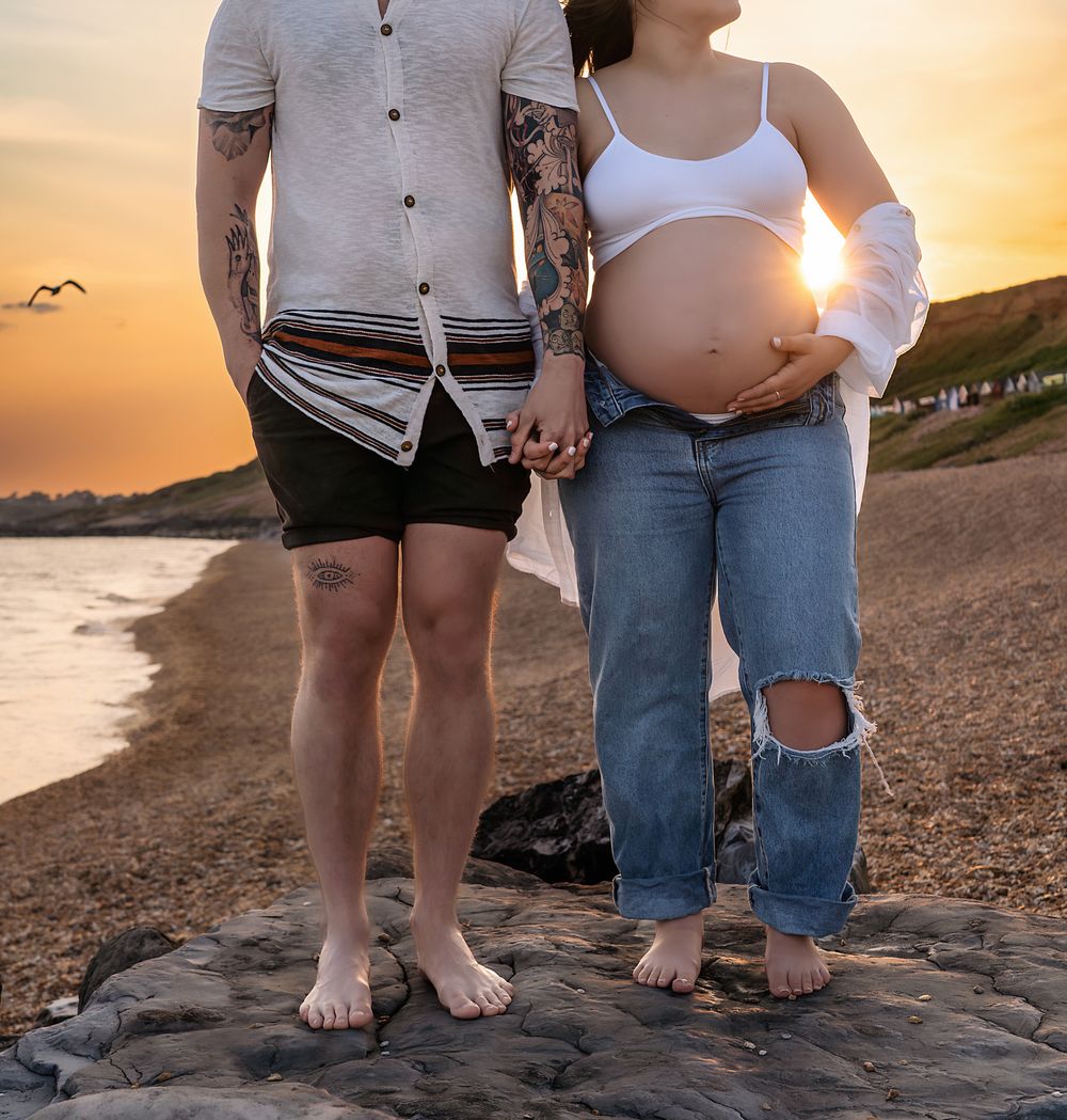 Barton on Sea, maternity photo session with a young couple at sunset.