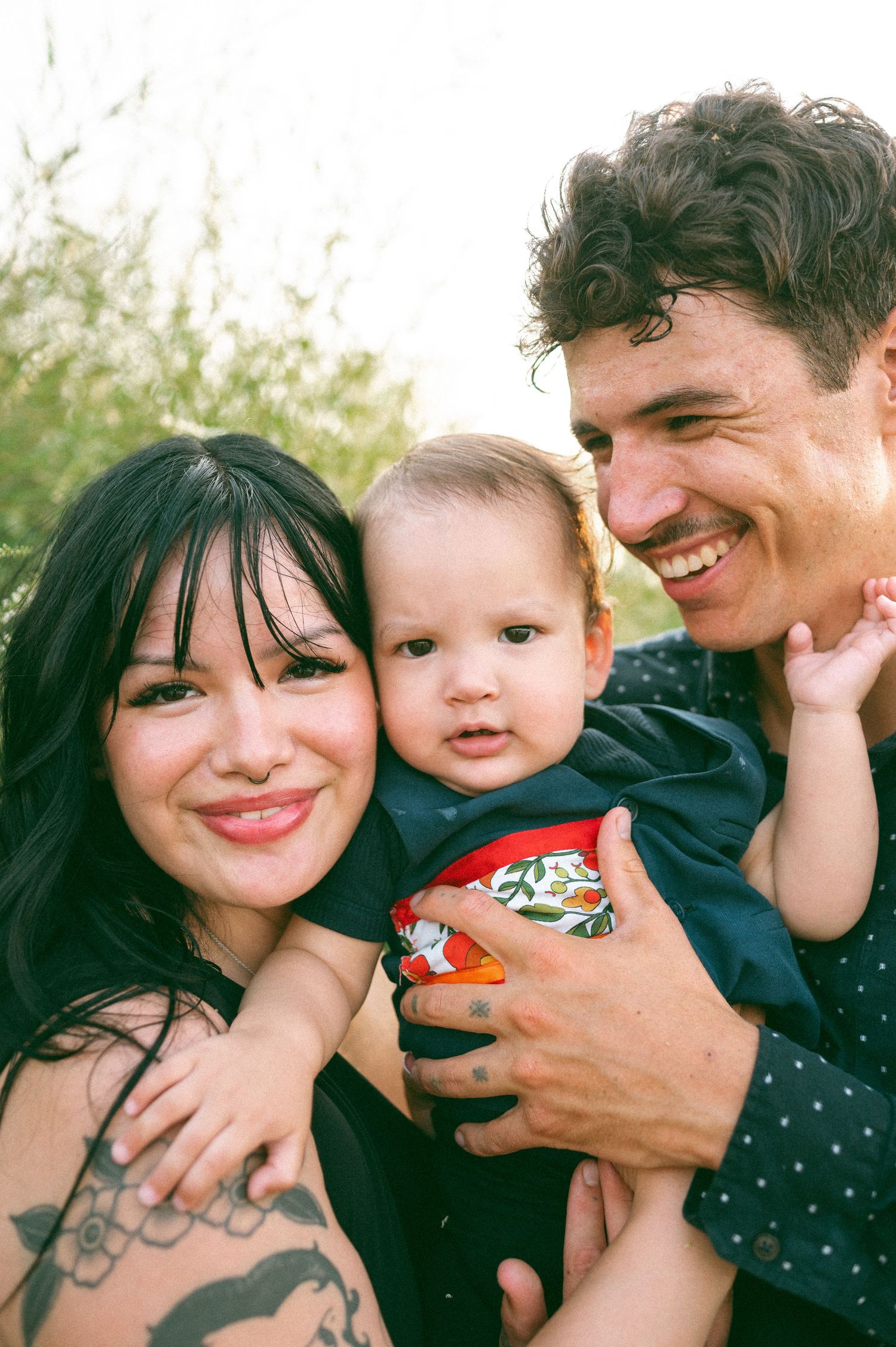 A tender outdoor family moment with a young child captured on film.