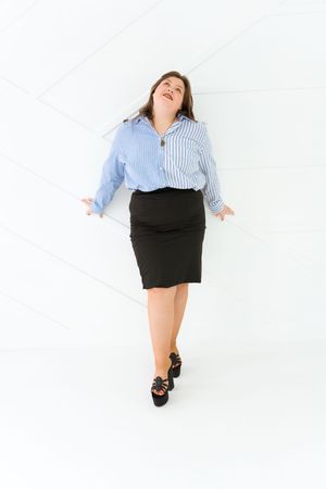 Professional wearing business attire poses against white background in dynamic series of shots.