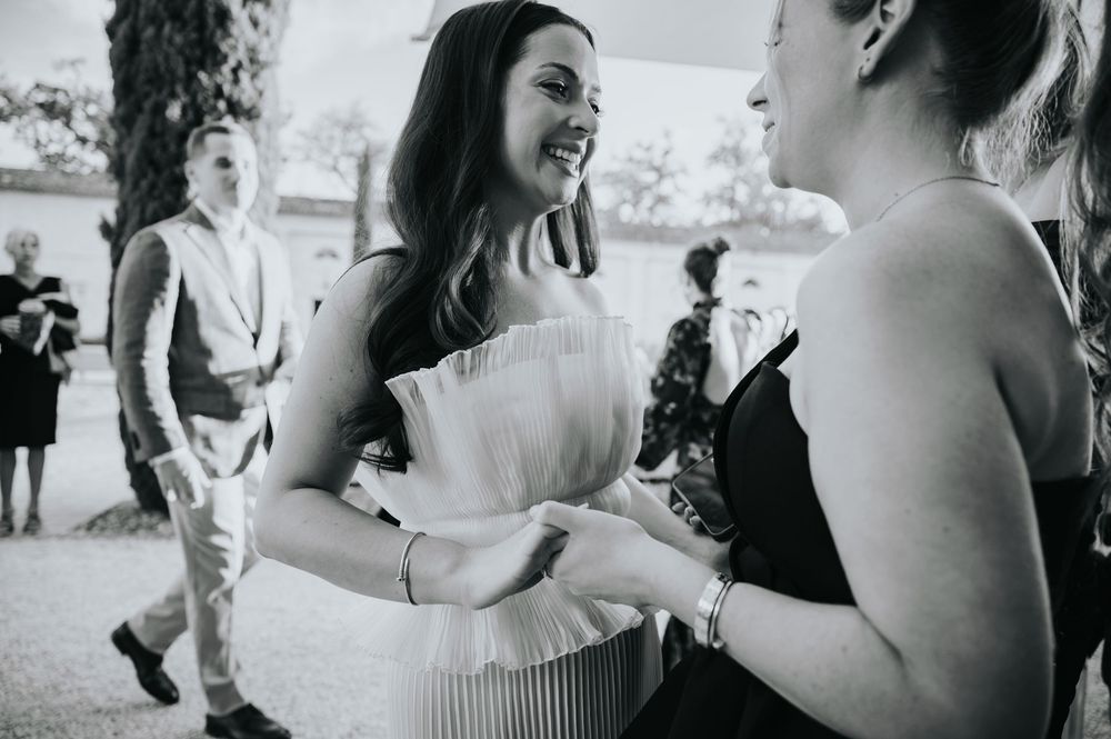 A candid black and white photo series showing joyful moments at a wedding celebration.