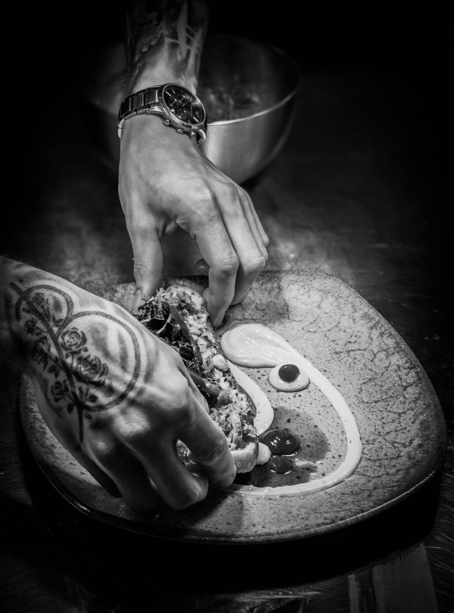 Chef Dale Spink plating up a dish ready for service Photographed by Simon Robertson Photography