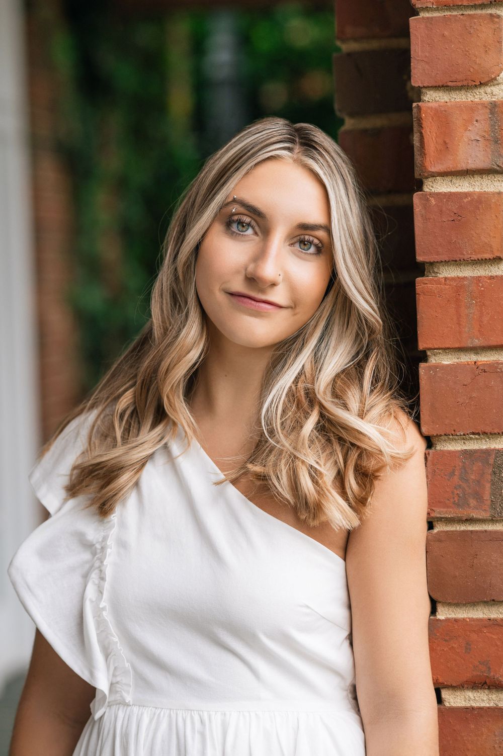 1. "Outdoor senior portrait of a high school graduate, with a focus on natural expressions and personal style.