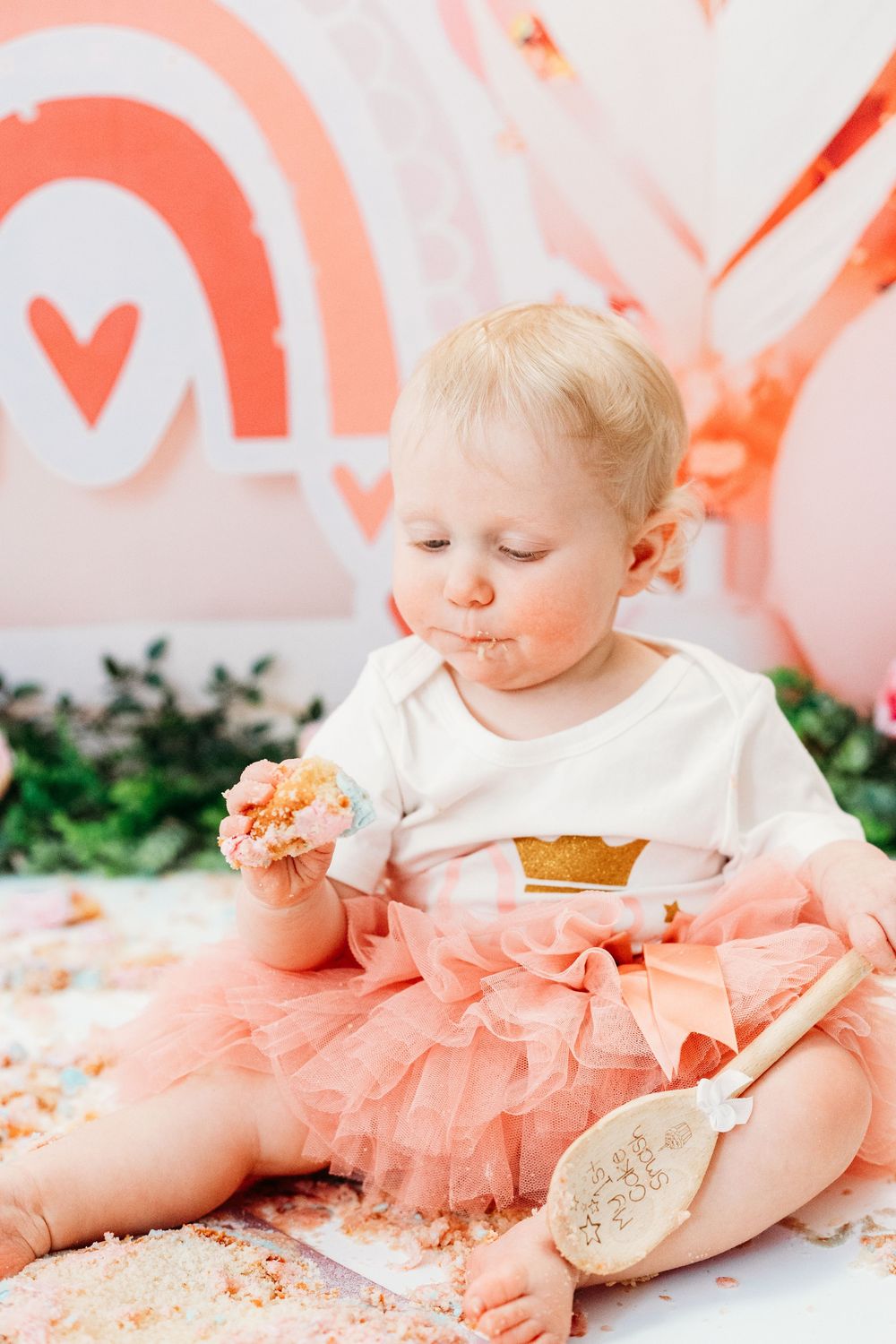 One-year-old baby covered in birthday cake icing.
