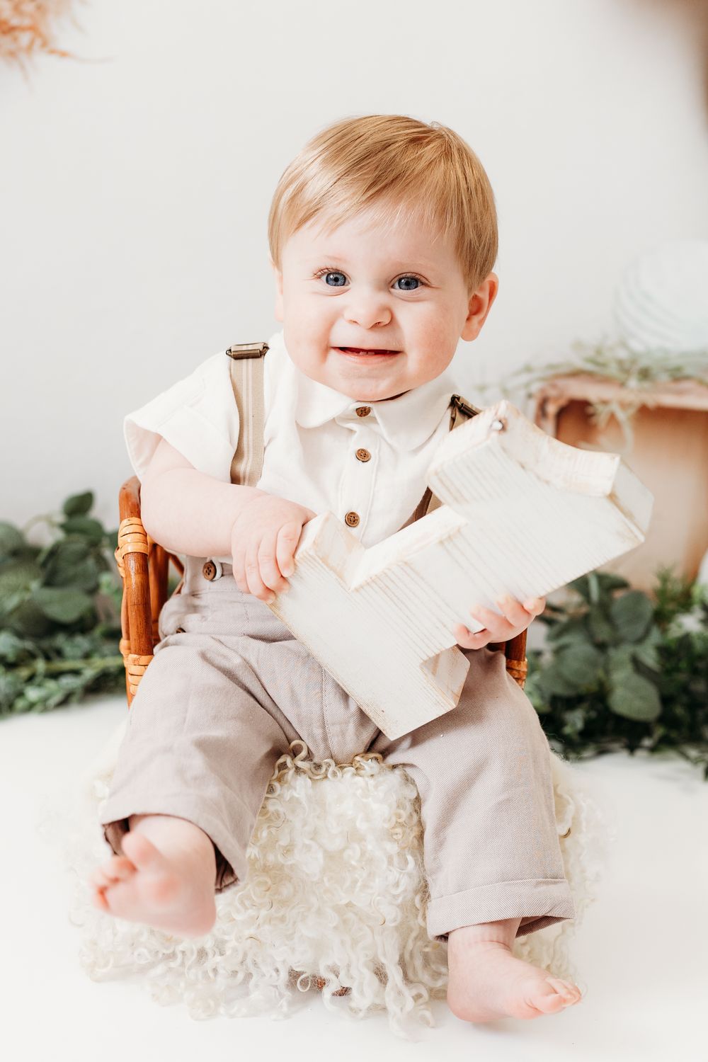 Baby’s first birthday cake smash in Mapperley studio, Nottingham photographer creating joyful and natural portraits.