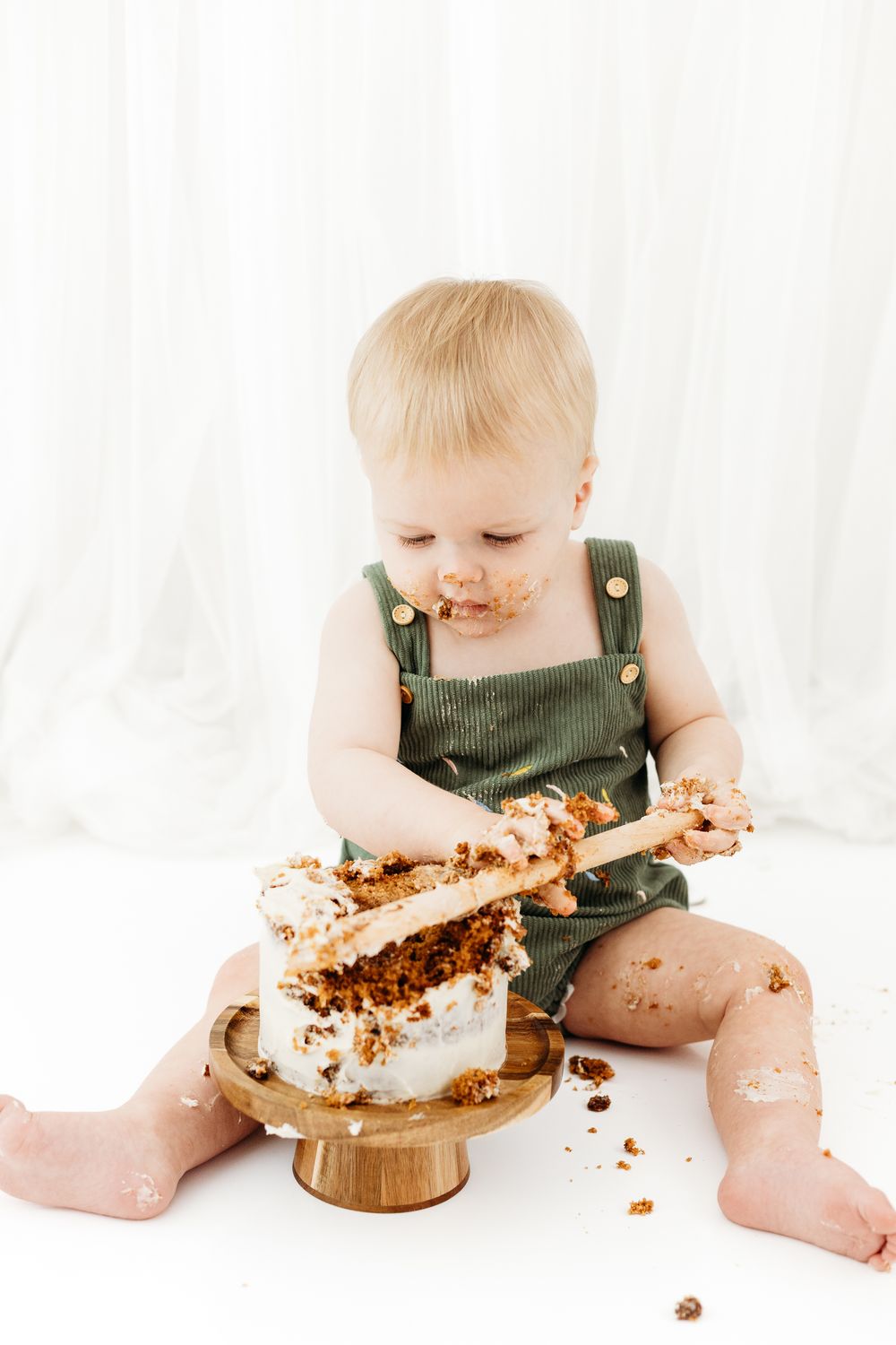 Mapperley studio cake smash session with one-year-old, Nottingham photographer creating clean and simple milestone portraits.