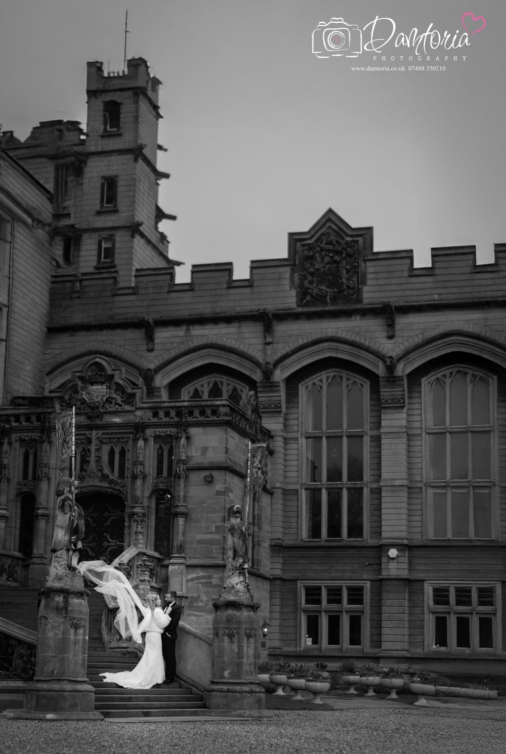 A series of black and white wedding photos showing a couple in romantic poses against a grand historic building facade.