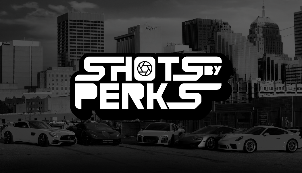 Shots by Perks automotive photography branding overlaid on an urban skyline with cars.