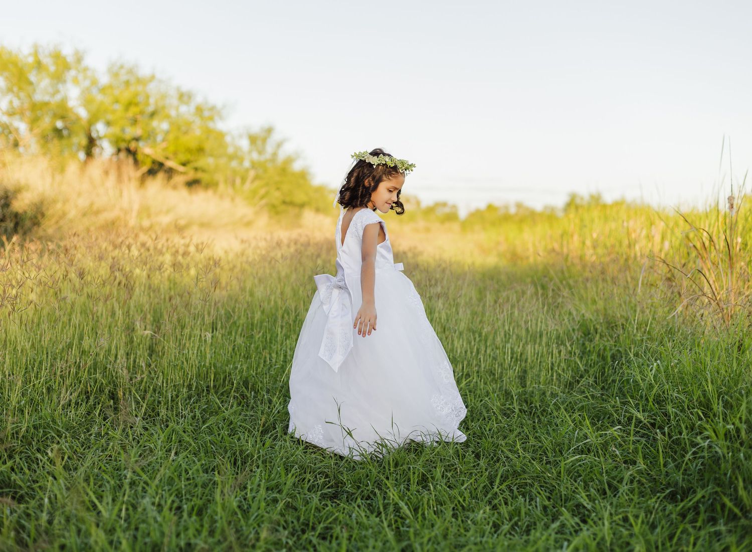 Young girl in a white dress during an outdoor portrait session