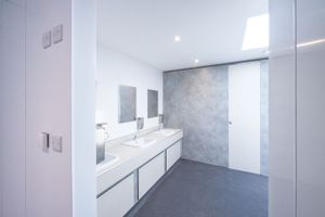 Architectural photography of commercial washroom installation and high-spec construction fit-out for technical project handovers.