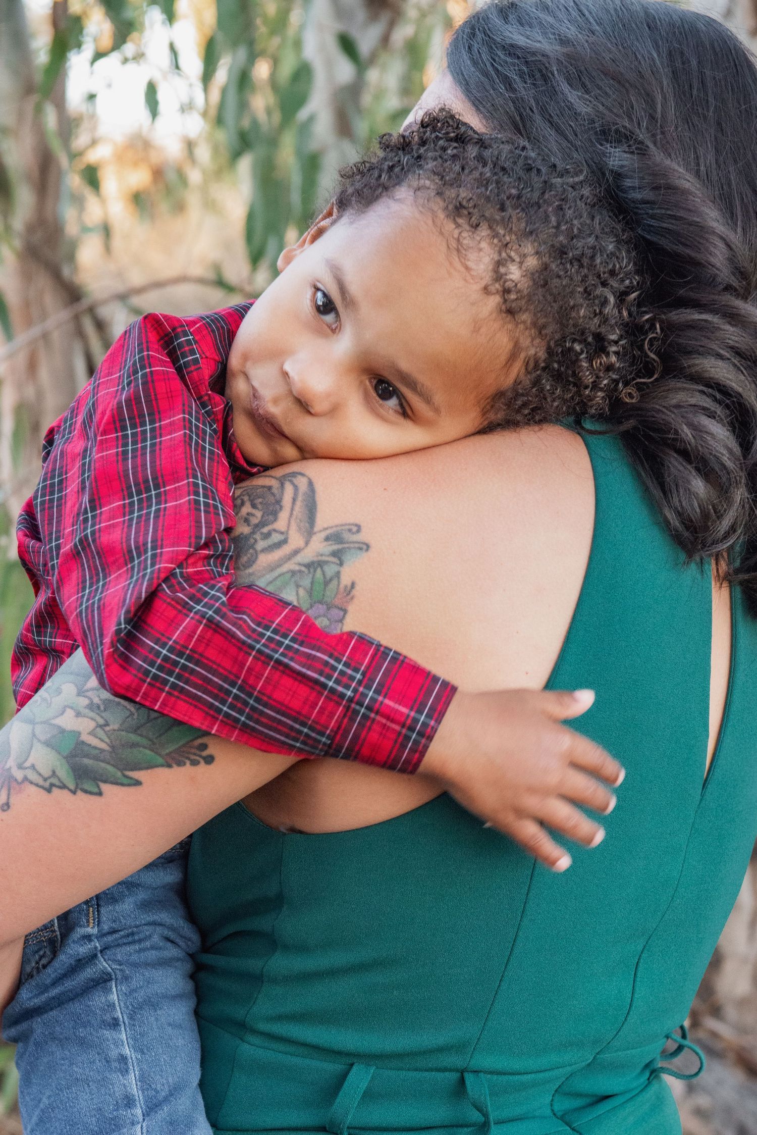 A series of intimate photos showing someone wearing a green top and red plaid shirt embracing and sharing tender moments.