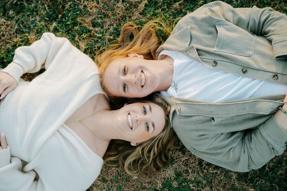 A series of romantic outdoor portrait photos showing a couple lying together on grass in soft natural lighting.