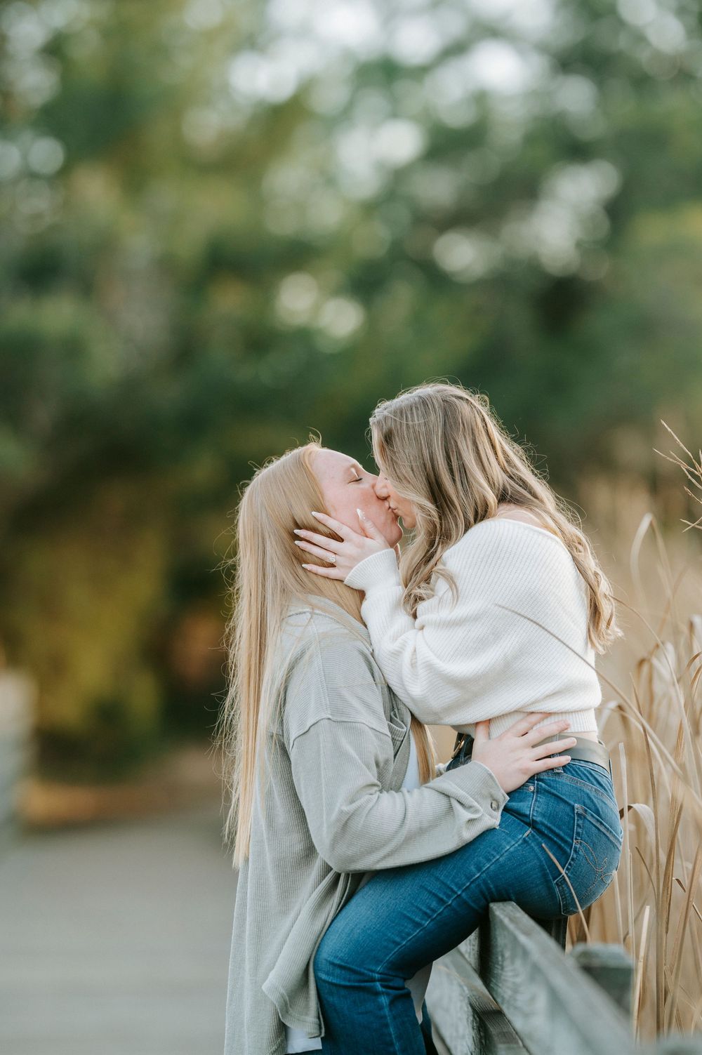 A series of candid photos showing two people embracing in a field with tall grass and blurred natural background.