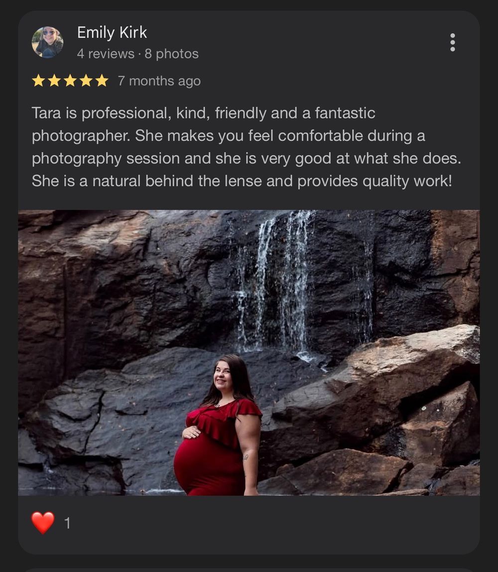 Outdoor portrait session in Greenville, SC featuring a woman in a flowing red dress, captured by a professional photographer.