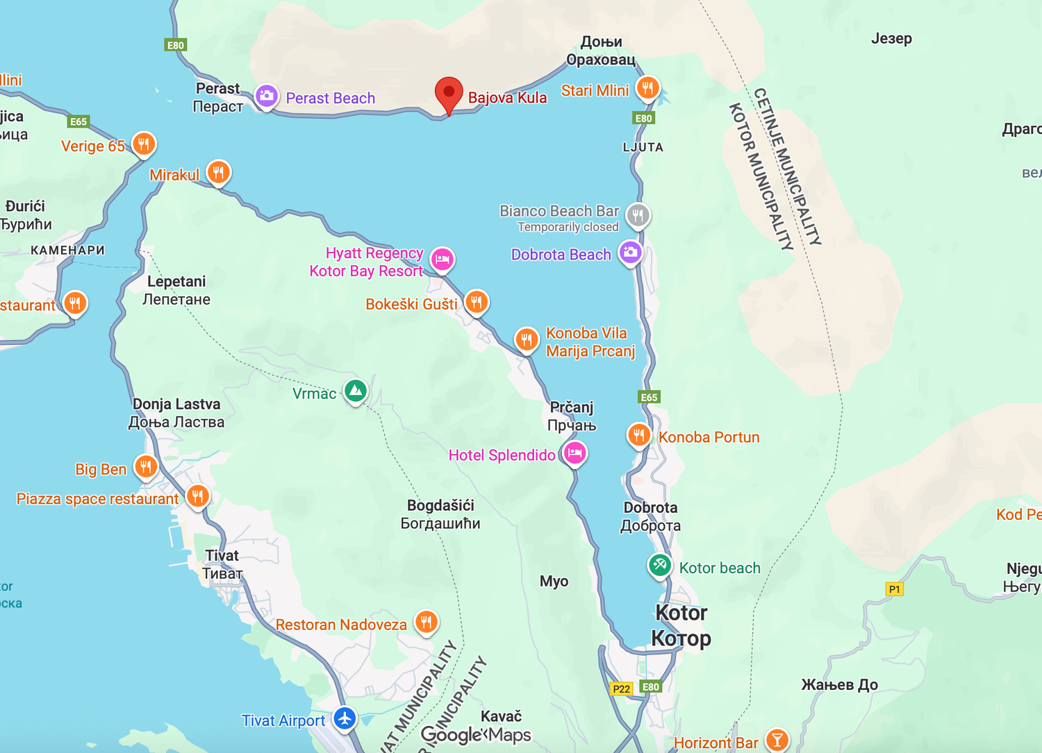 A detailed satellite map view of a coastline with roads and geographic features shown in various colors.
